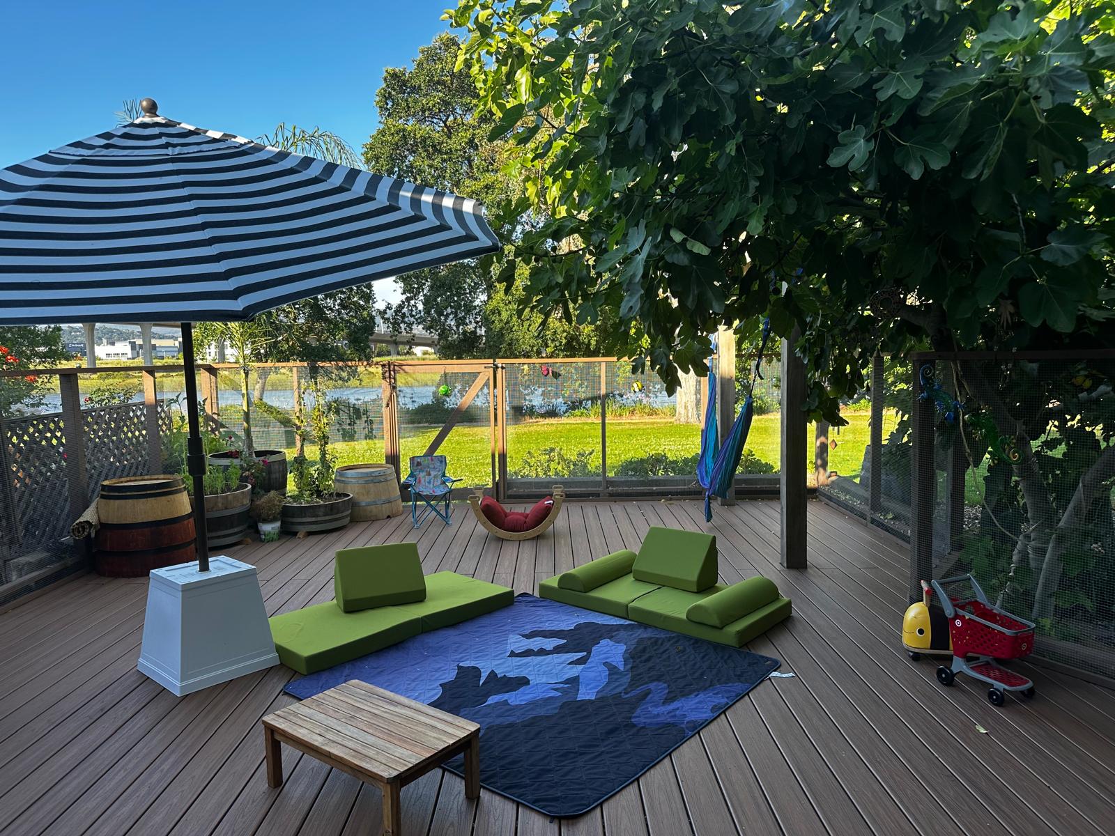 Shaded outdoor deck with reading nook and garden
